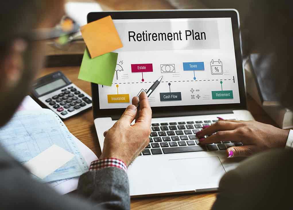 586047491 People discussing retirement plan on laptop screen