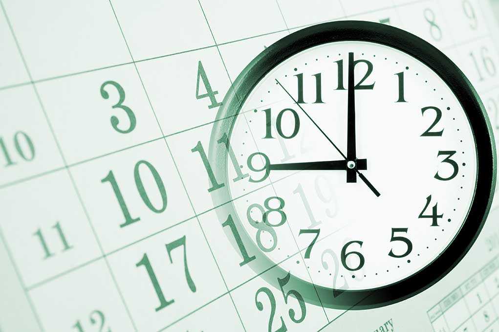 shutterstock_173563493.jpg A clock overlaying a calendar illustrating the concept of time management