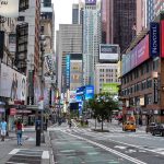 Times Square street scene with storefronts and advertisements