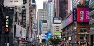 Times Square street scene with storefronts and advertisements