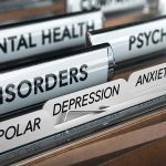 File folders labeled with mental health disorders and psychiatry