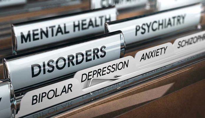 758549185 File folders labeled with mental health disorders and psychiatry