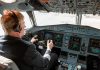 AI Cockpit Chaos—469 Lives Nearly Lost Pilot in cockpit operating airplane controls.