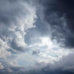 Dramatic clouds in a stormy sky with varying shades of gray