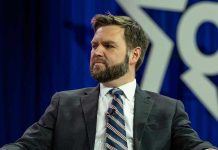 Man in a suit with a thoughtful expression.