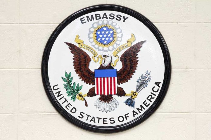 shutterstock_228233305.jpg Seal of the United States Embassy featuring an eagle and the American flag