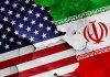 Iran’s Retaliation: Six U.S. Troops Dead Cracked American and Iranian flags on a wall.