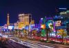 Vibrant view of the Las Vegas Strip at night with neon lights and traffic
