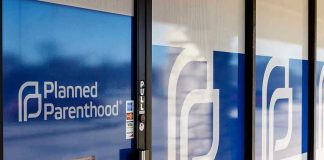 Federal Funds Scandal: What Planned Parenthood Hides? Planned Parenthood office entrance with logo and signs.