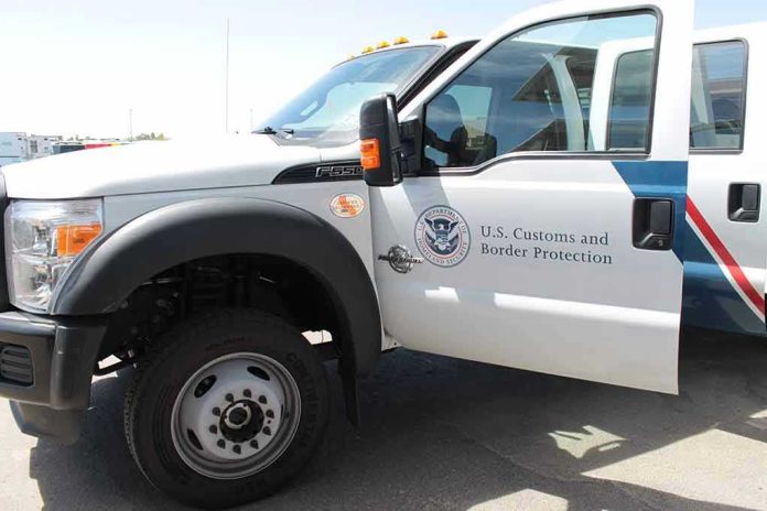 1434041024 U.S. Customs and Border Protection truck with open door.
