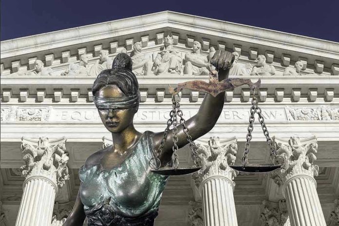560959042-1 Lady Justice statue in front of courthouse.