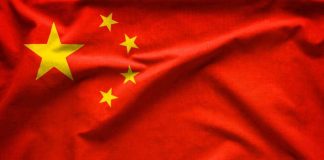 China Front Exposed in Iran Tech Plot Red flag with five yellow stars, Chinas flag.