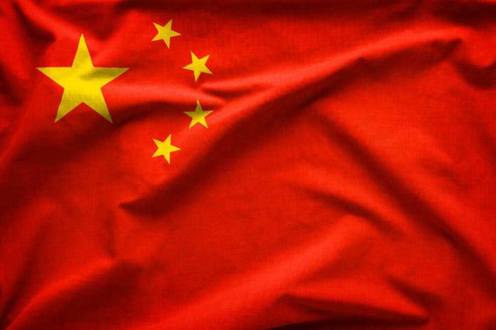 shutterstock_1286673253 Red flag with five yellow stars, Chinas flag.
