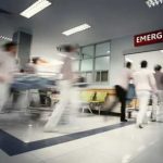 Celebrity Flight Emergency Sparks Media Speculation Storm Medical staff rushing patient on stretcher in emergency room.