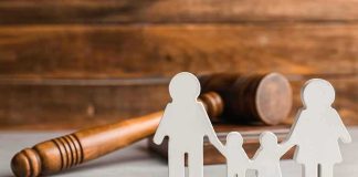 Smiling Mom’s Vacation Video Haunts Triple-Murder Trial Paper cutout family with gavel in background