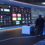 A Database Change Revealed a Higher Human Cost cybersecurity operations room with large data dashboards and people discussing