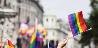 Pride flags waved at a city parade