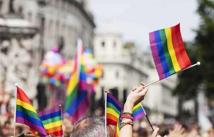 Pride flags waved at a city parade