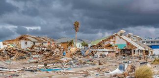 storm-damaged coastal neighborhood with demolished houses