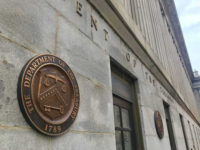 shutterstock_1274705839 U.S. Treasury building exterior with bronze seal on stone wall