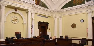 Judge Rules Mother Not Criminally Responsible empty courtroom with judge's bench and columns