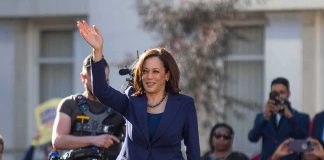 Alaska Democrat Rejects Harris Support woman in navy suit waving at an outdoor event