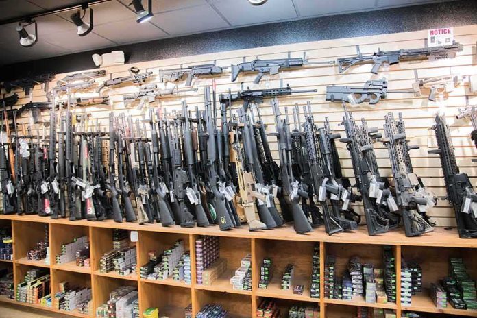 shutterstock_1455560747 Wall of rifles and shotguns in a gun store