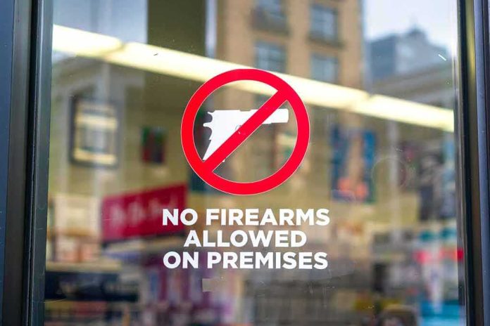 shutterstock_1595805553 No firearms allowed sign on a store window