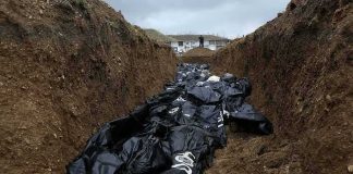 Mass Graves Mapped—Nepal’s Flood Death Toll Climbed to 781 Counting Body bags in a mass grave trench