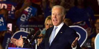 Michigan Meltdown: Piker Ties Put El-Sayed on Defense man speaking at a podium during a campaign rally