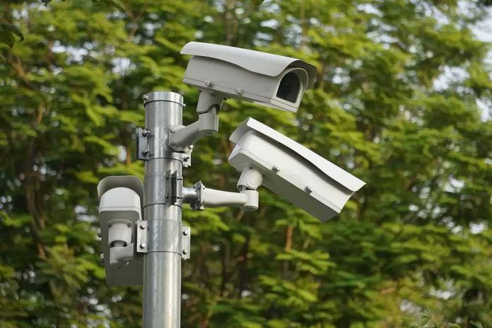 shutterstock_1924933001 surveillance cameras mounted on a metal pole