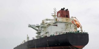 U.S. Claims Major Venezuelan Oil Deal Large oil tanker anchored in calm sea