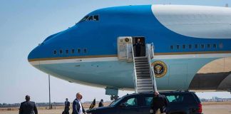 Classified Access Axed—Air Force One Mystery Security detail near blue and white aircraft with staircase and SUV