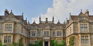They Never Knew the Walls Were Listening Historic mansion with ornate stone facade and gabled roofs