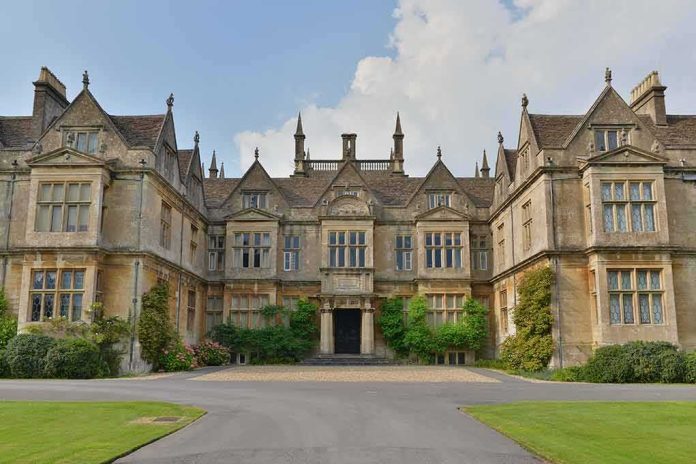 shutterstock_2112553256 Historic mansion with ornate stone facade and gabled roofs
