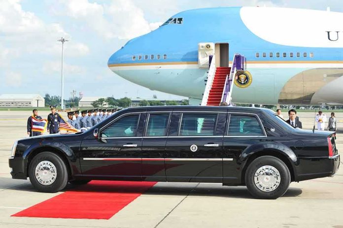 Presidential limousine beside a large blue-and-white jet on a runway