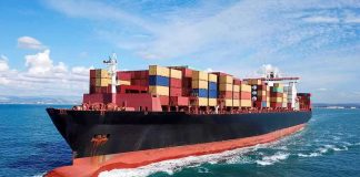 Hormuz Shipping Falls To Historic Lows Container ship carrying stacked cargo at sea