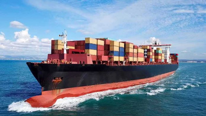 shutterstock_747090706 Container ship carrying stacked cargo at sea