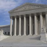 Supreme Court building with grand columns and steps