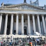 Clemency Bombshell: Teen Dead, Feds Move In Reporters and photographers gathered outside a neoclassical courthouse