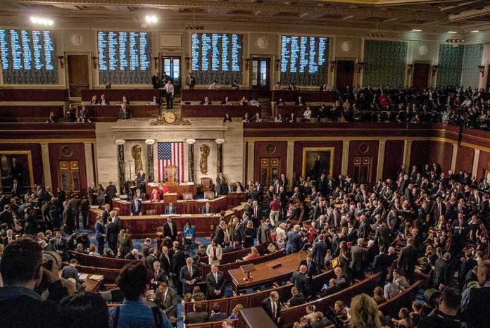 shutterstock_1186368289-1 House chamber filled with lawmakers and staff