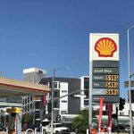 Shell gas station with price sign on a sunny day