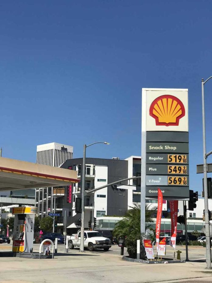 Shell gas station with price sign on a sunny day