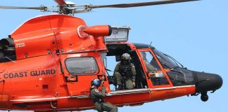 Florida Family Dies in Bahamas Plane Crash Rescue helicopter with crew performing hoist operation
