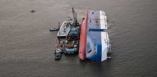 Ferry Fire Death Toll Rises to 35 Capsized cargo ship with salvage vessels alongside