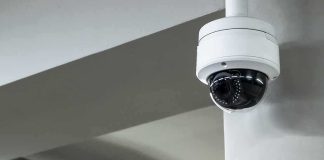 Flock Cameras Spark Crime and Privacy Debate Dome security camera mounted on a ceiling corner