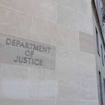 The U.S. Pulled the Plug: Then Quietly Switched It Back On Department of Justice building exterior with American flags