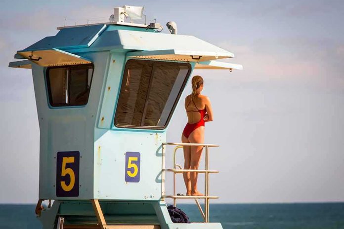 shutterstock_1606674157 Lifeguard on a tower overlooking the ocean