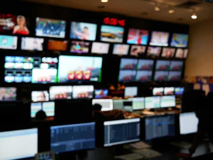 shutterstock_1860150187 control room with multiple screens and monitors