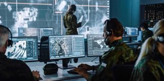 U.S. Confirms Space Weapons Military analysts at computers in a command center